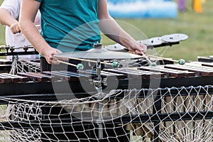 A keyboards player working his magic at a marching band rehearsal