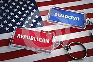 keychain of the Republican Party and the Democratic Party on the background of the US flag. Opposition of Republicans and photo