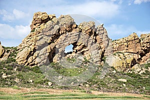 Keyhole rock formation is a landmark on the popular Devils Backbone hogback hiking trail in Loveland, CO