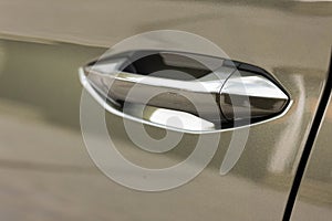 Keyless entry car door handle with keyless go touch sensor. Automatic opening of a car door without a key. Car door handle. Access