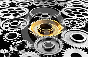 Keyman,key success or leadership concepts with metal gold cog outstanding in another cogs.Business performance