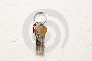 Keyring hanging on wall with keys photo