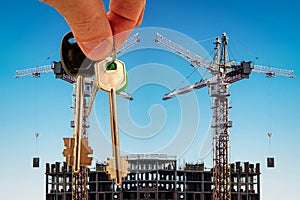 The keys on the background of the construction of new modern buildings .