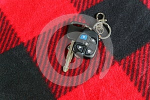 Keys from the car on the red fabric alarm system