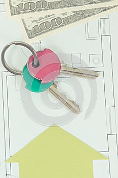 Keys with currencies dollar on electrical diagrams, mortgage loan for buying house concept