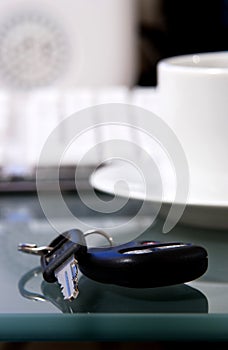 Keys on desk next to computer