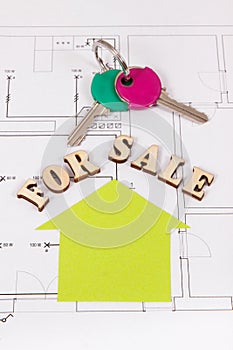 Keys, home shape with inscription for sale on housing plan, selling or buying house