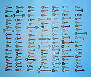Keys set on blue background. Door lock keys and safes for property security and house protection. Different antique and new types