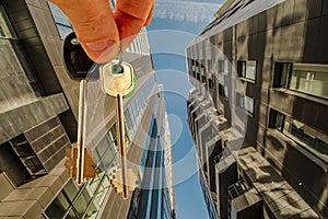 The keys to the apartment in the background of the facade of the house .