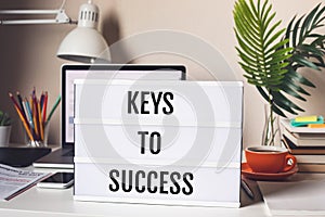 Keys to success concepts with text on light box