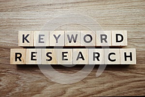 Keyword Research alphabet letter on wooden background