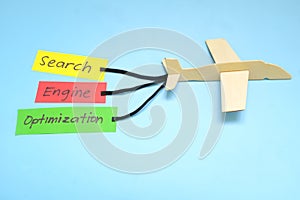 Keyword and Search Engine Optimization or SEO importance and key for success concept in business marketing. Airplane model