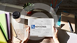 Keywords. SEO, Search engine optimization and internet marketing concept on screen.