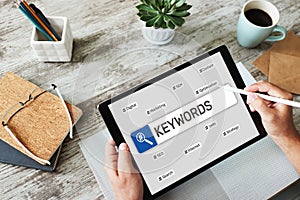 Keywords. SEO, Search engine optimization and internet marketing concept on screen.