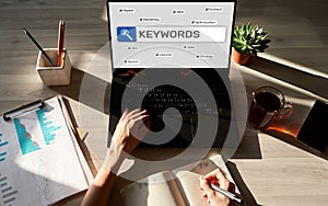 Keywords. SEO, Search engine optimization and internet marketing concept on screen.