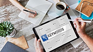 Keywords. SEO, Search engine optimization and internet marketing concept on screen.