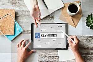 Keywords. SEO, Search engine optimization and internet marketing concept on screen.