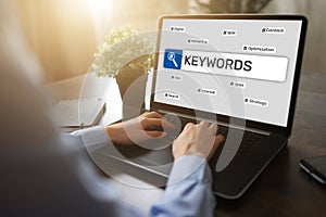 Keywords. SEO, Search engine optimization and internet marketing concept on screen.