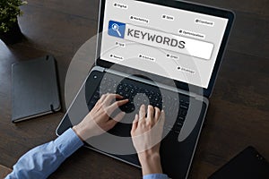 Keywords. SEO, Search engine optimization and internet marketing concept on screen.