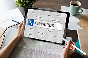 Keywords. SEO, Search engine optimization and internet marketing concept on screen.