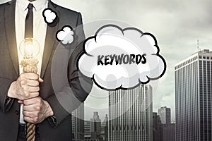 Keywords text on speech bubble with businessman