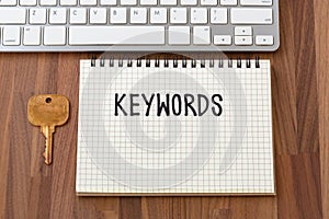 Keywords word on notebook with key