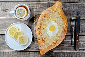 Khachapuri in Adjara with cheese and egg