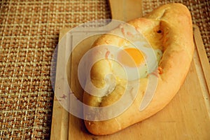 Khachapuri in Adjara with the egg. The Georgian cuisine.