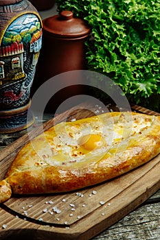 Khachapuri in Adjarian on the Board