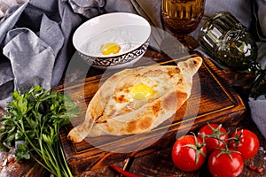 Khachapuri in Adjarian. Open pie with mozzarella and egg