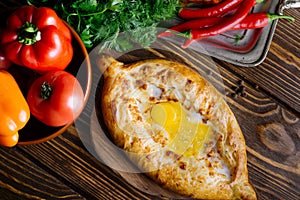 Khachapuri in Adjarian. Open pies with mozzarella and egg. Georgian cuisine