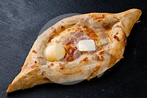 khachapuri with cheese and egg on a plate