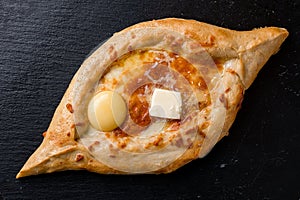 khachapuri with cheese and egg on a plate