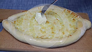 Khachapuri, Georgian cheese dough, greased with butter