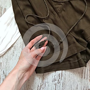 Khaki shorts on a wooden background