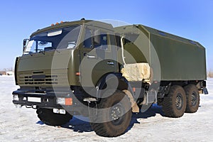Khaky heavy resque military truck,car on blue sky with antenne photo