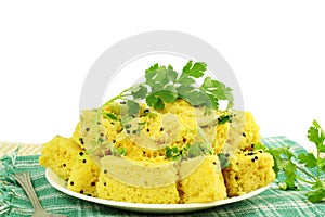 Khaman dhokla traditional gujrati indian snack food dish in white background