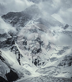 Khan Tengri peak a winter storm. 7010m photo