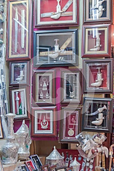 Khanjar (daggers) in frames sold as souvenirs in Muttrah Souk, in Mutrah, Muscat, Oman, Middle East