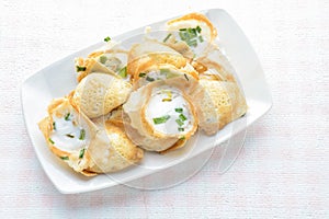 Khanom khrok or coconut-rice pancakes are one of the ancient Thai desserts. They are prepared by mixing rice flour, sugar, and