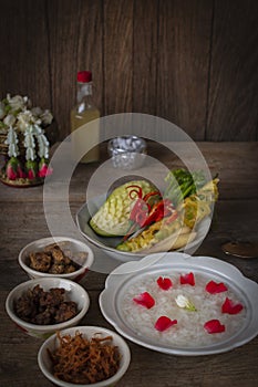 Khao-Chae, Cooked Rice Soaked in Iced Water in the white bowl and Eaten with the Usual Complementary Food and to decorate by