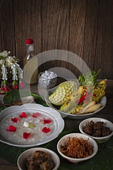 Khao-Chae, Cooked Rice Soaked in Iced Water in the white bowl and Eaten with the Usual Complementary Food and to decorate by