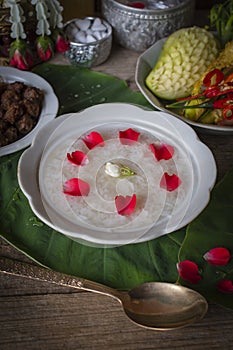 Khao-Chae, Cooked Rice Soaked in Iced Water in the white bowl and Eaten with the Usual Complementary Food and to decorate by