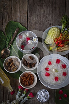 Khao-Chae, Cooked Rice Soaked in Iced Water in the white bowl and Eaten with the Usual Complementary Food and to decorate by