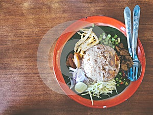 Khao kluk kapi Shrimp Paste Fried Rice on the wooden table