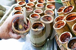 Khao Lam, Thai bamboo tube of sweet custard sticky rice dessert, Nongmon market, Chonburi, Thailand