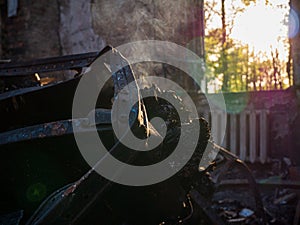 Kharkiv region, Kharkov, Skovorodinovka, Skovorodinivka, Ukraine - 05.07.2022: ruins burnt smoking destroyed metal pile