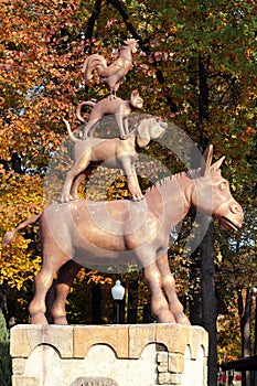 Kharkiv, Ukraine - October 10, 2021: Bronze statue in Kharkiv Central Park, depicting donkey, dog, cat and rooster - characters of