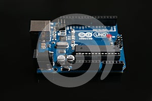 Arduino UNO board on black background