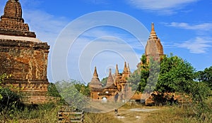 Khay Min Gha pagoda complex with a dog, blue sky, sunny day